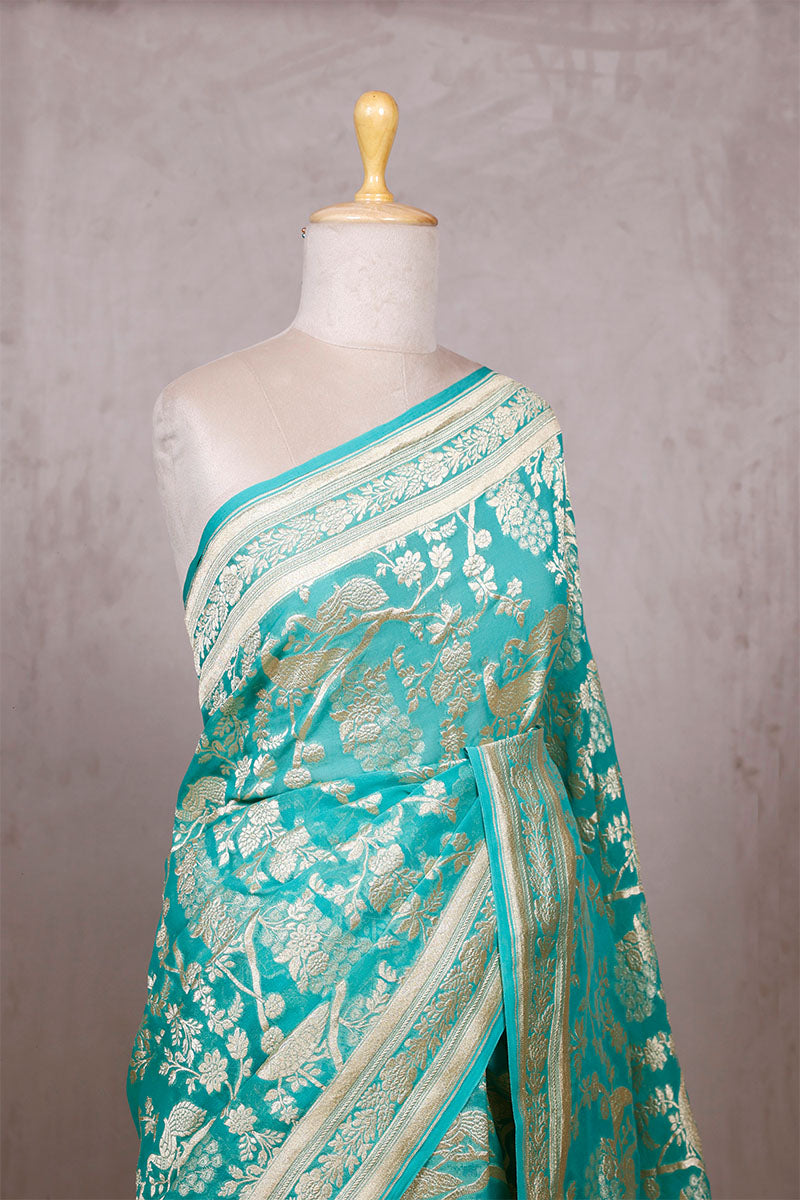 Sky Blue Georgette Khaddi Saree with Peacock Floral Work