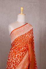 Orange Georgette Khaddi Saree with Mayur Floral Work